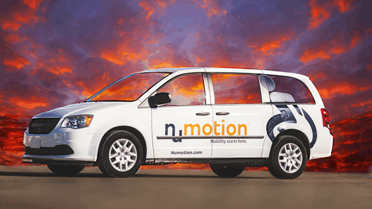 A white minivan with Numotion branding and the slogan Mobility starts here is parked on pavement, with a dramatic sunset sky in the background. The van offers home delivery, making accessibility more convenient.