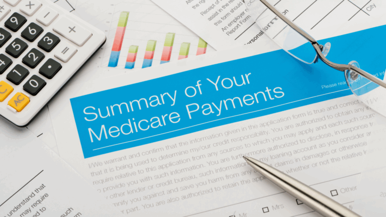 A document titled Summary of Your Medicare Payments lies on a desk with a pen, eyeglasses, a calculator, and charts, suggesting a financial review related to Medicare Power Mobility and required documentation for healthcare expenses.