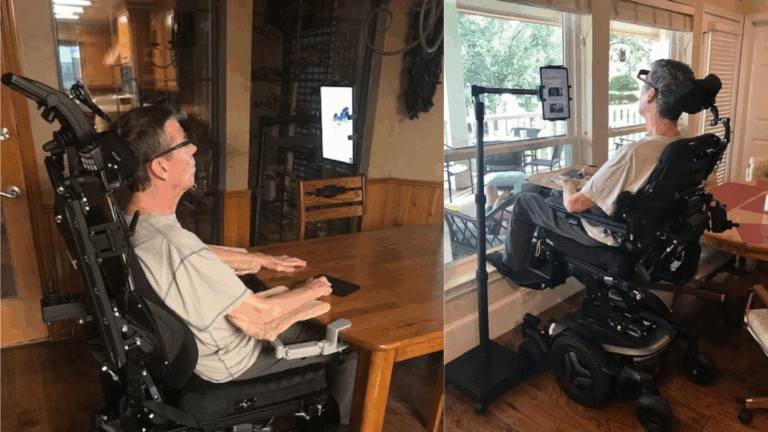Two photos of a man in a motorized wheelchair using a mounted tablet; one shows him at a wooden table indoors, and the other captures him facing a window with trees outside.