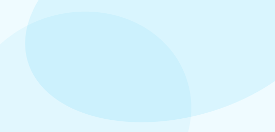 Abstract background with overlapping translucent blue ovals and circles on a light blue and white backdrop.