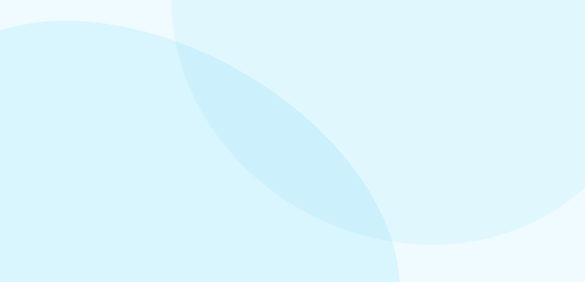 Abstract background with large, overlapping, semi-transparent blue and white circles creating a soft, minimalist design.