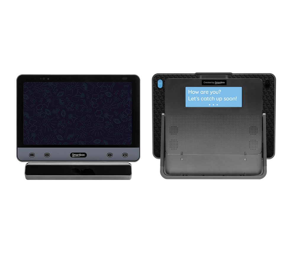 Front and back view of a black touchscreen speech-generating device with a camera. The back screen displays the message: How are you? Let’s catch up soon! in blue text, showcasing its assistive technology features.