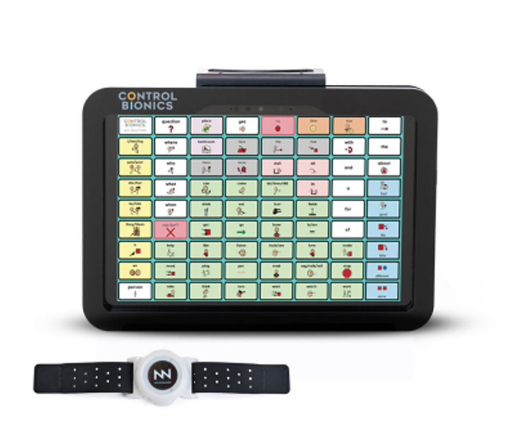 A communication device with a colorful, grid-style touchscreen showing symbols and words, labeled Control Bionics, is paired with a NueroNode Duo wearable sensor wristband placed in front as part of innovative assistive technology.