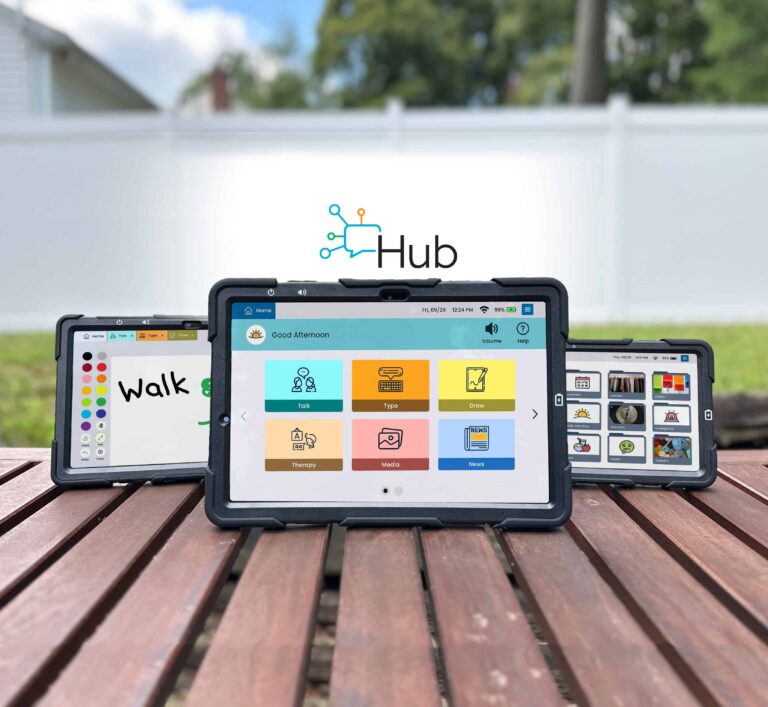 Three Lingraphica communication devices in rugged cases stand on a wooden surface outdoors, each displaying different apps. A Lingraphica Hub logo is in the background, with a white fence and trees behind them.