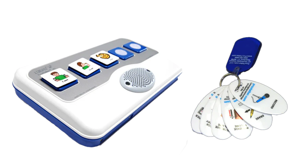 A white and blue speech communication device with picture buttons and a speaker sits beside a keyring holding laminated cards, each displaying illustrated AAC communication symbols.